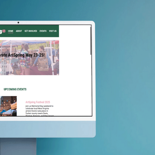 Closeup of Artspring homepage on a desktop computer against a blue background