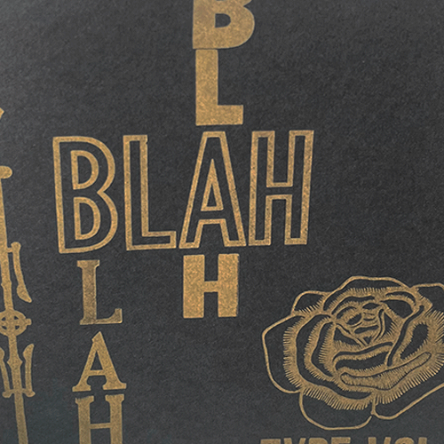 gold text reading blah on a black background