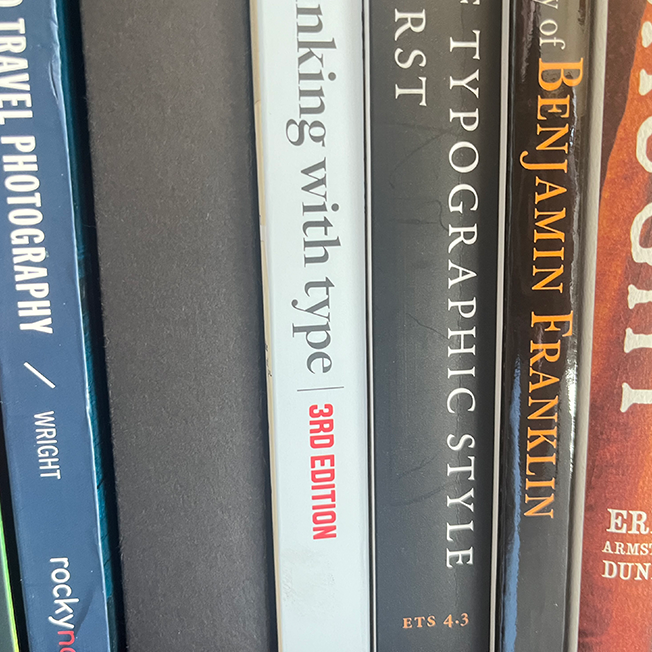 spines of books in a collection