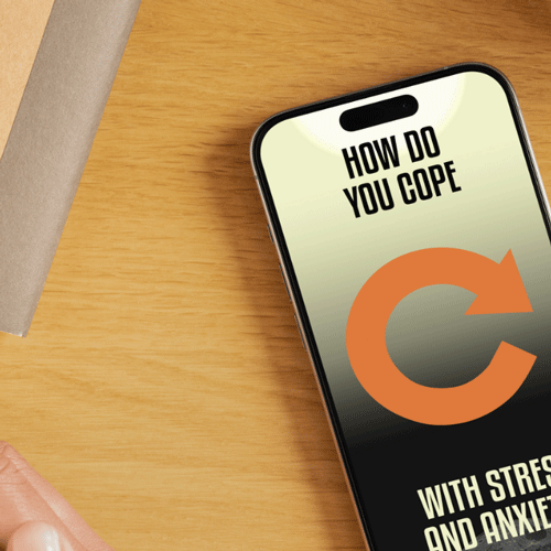 Closeup of phone screen with a tedtalk instagram story on a wooden desk