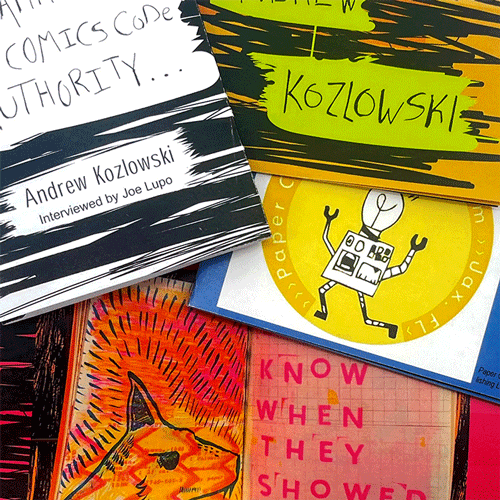 Closeup of zines placed haphazardly on top of each other